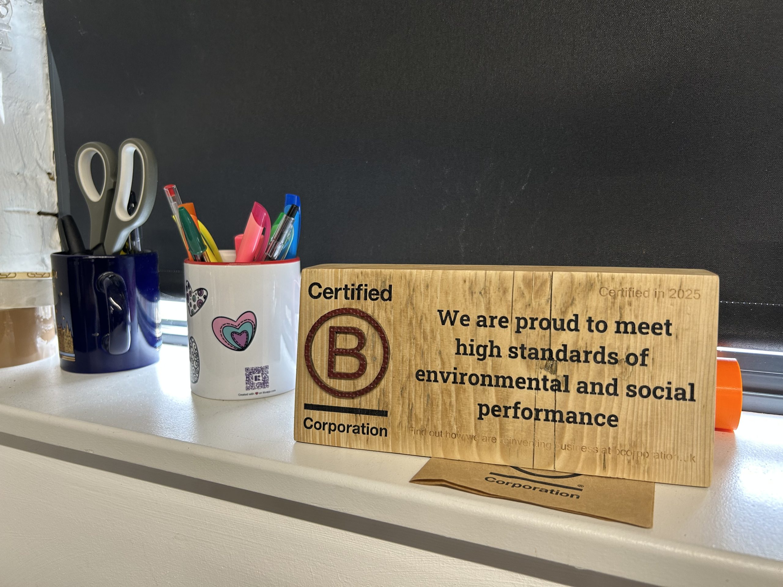 B Corp certifcation block on a windowsill
